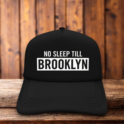 Beastie Boys No Sleep Till Brooklyn 90s hip hop vintage design on a black and white mesh retro trucker hat
