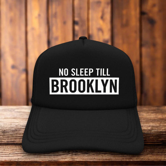 Beastie Boys No Sleep Till Brooklyn 90s hip hop vintage design on a black and white mesh retro trucker hat
