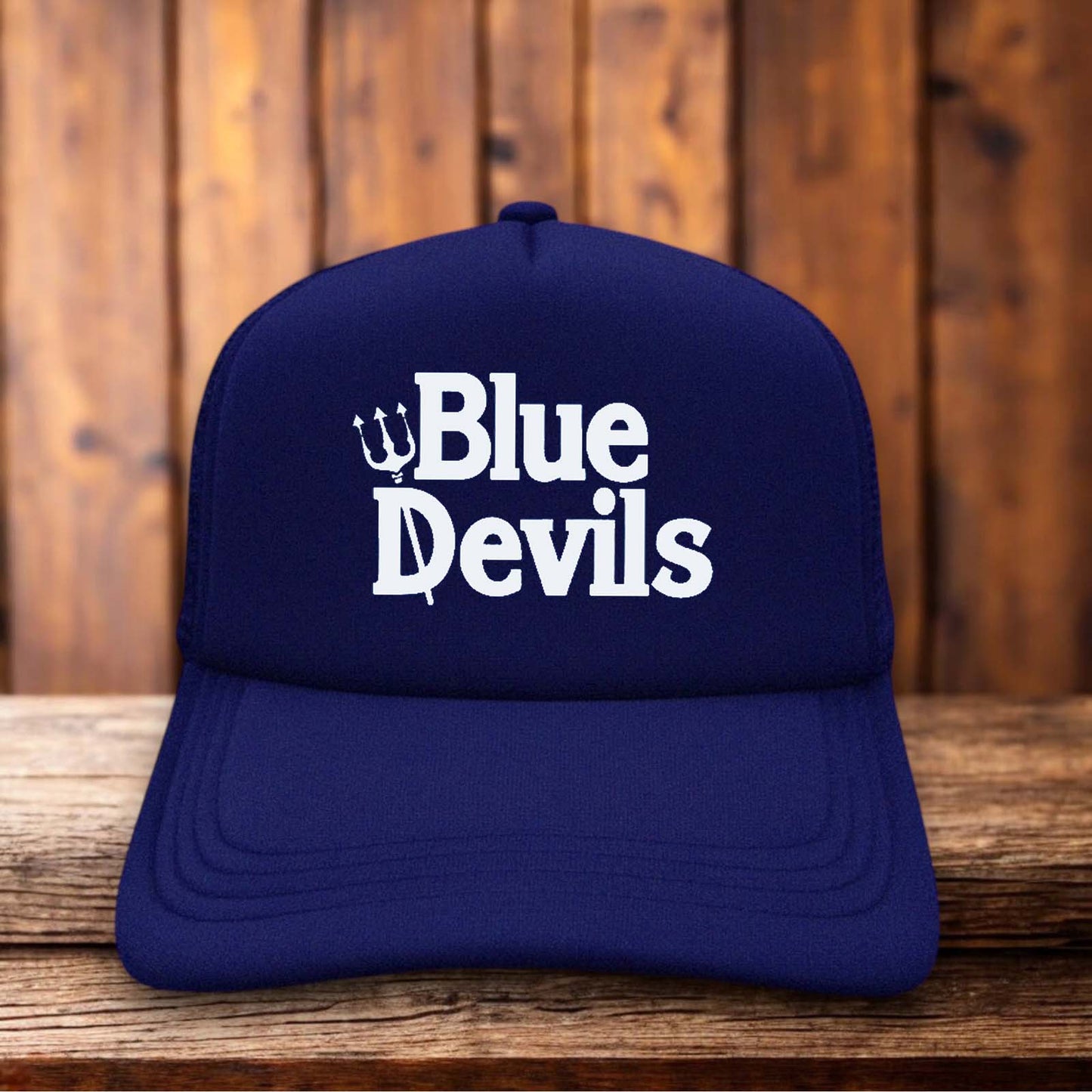 A two-toned polyester trucker hat featuring a vintage Duke Blue Devils logo.