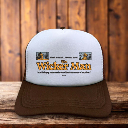 Retro trucker hat featuring The Wicker Man 1973 title in weathered vintage typography on a structured foam front.