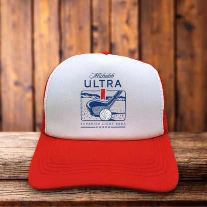 Red and white retro trucker hat featuring the Michelob Ultra Golf logo on a structured foam front.