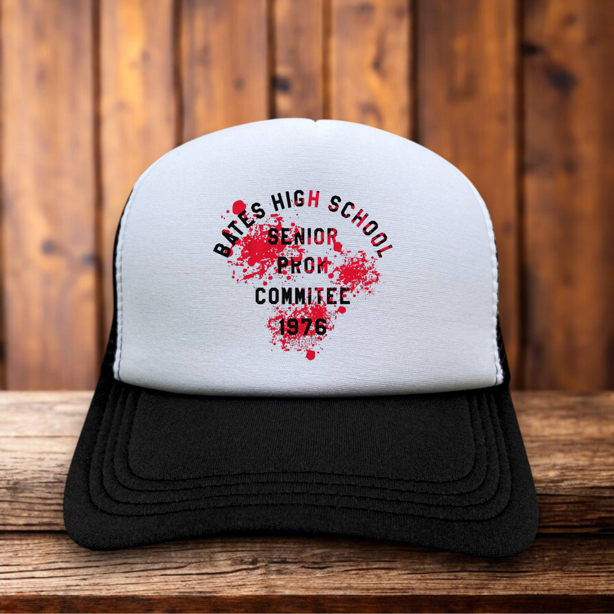 Stephen King's Carrie 1976 horror Bates High School vintage design on a black and white mesh retro trucker hat
