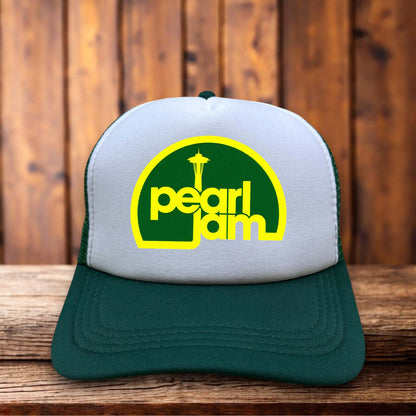 A classic trucker hat with a vintage-washed front panel featuring a distressed Pearl Jam logo and Eddie Vedder inspired typography in a 90s rock style.
