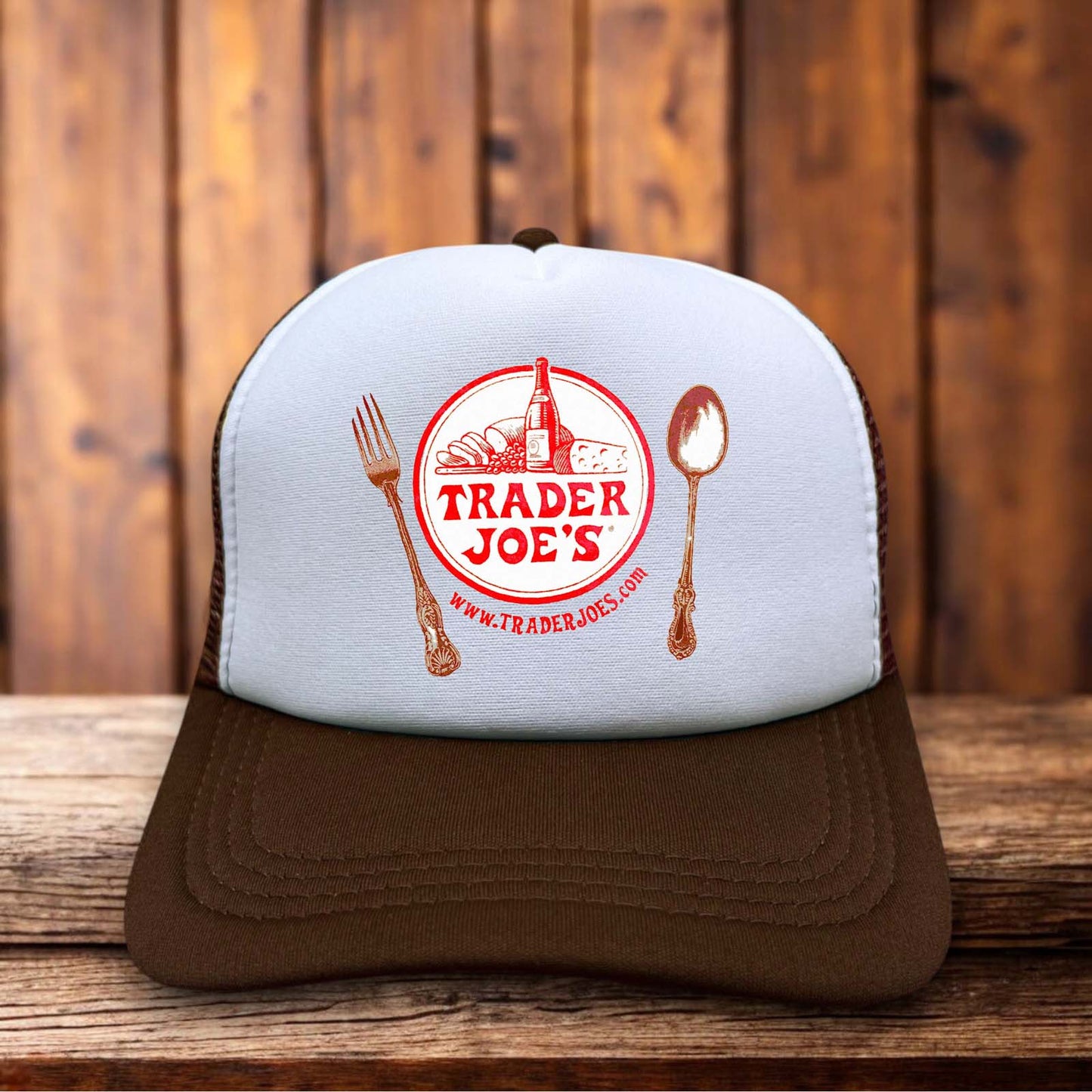 A classic trucker hat with a white foam front featuring a rare, vintage-style Trader Joe's logo in bold red and tropical-inspired typography.