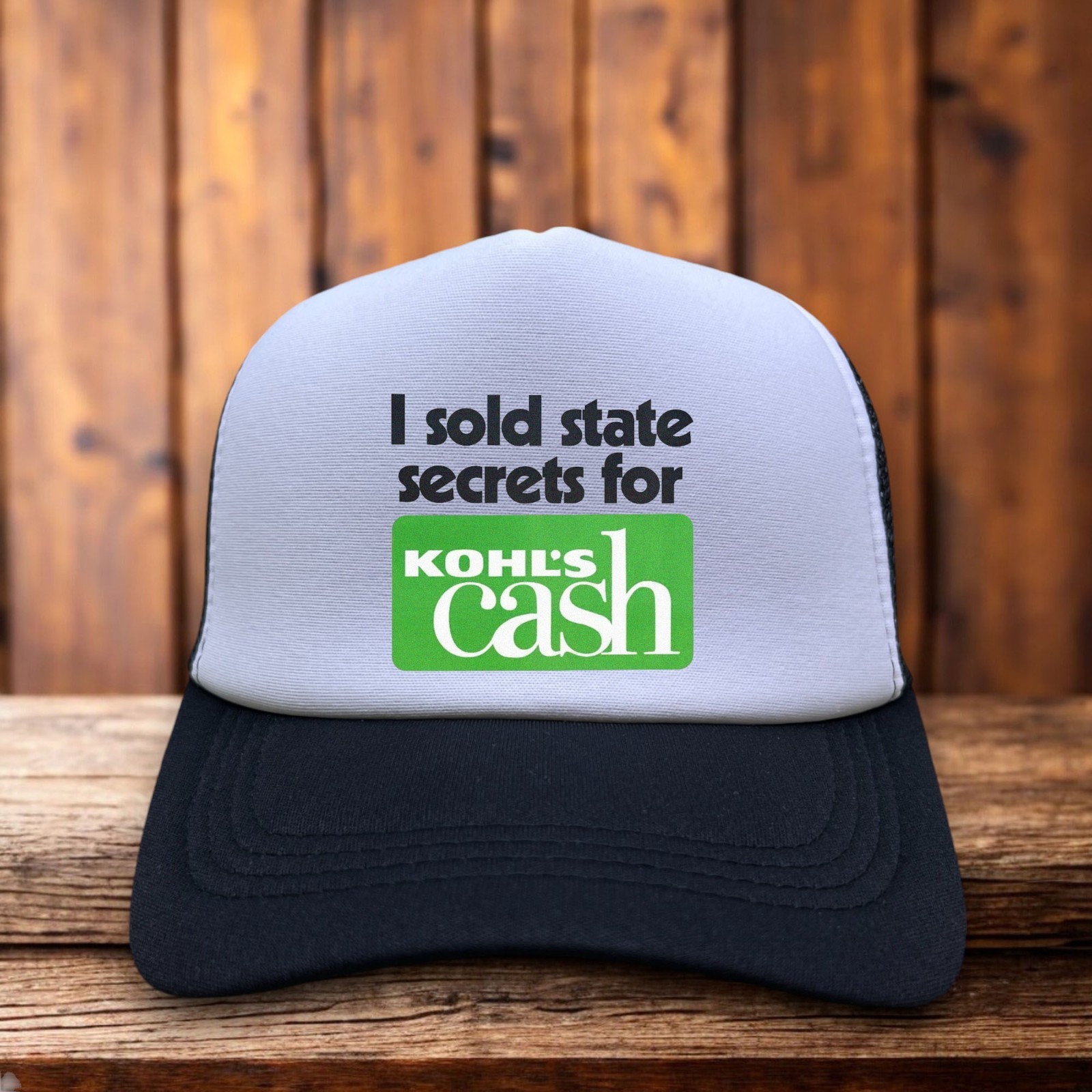 I Sold State Secrets For Kohl’s Cash” trucker hat with bold retro lettering, foam front and mesh back