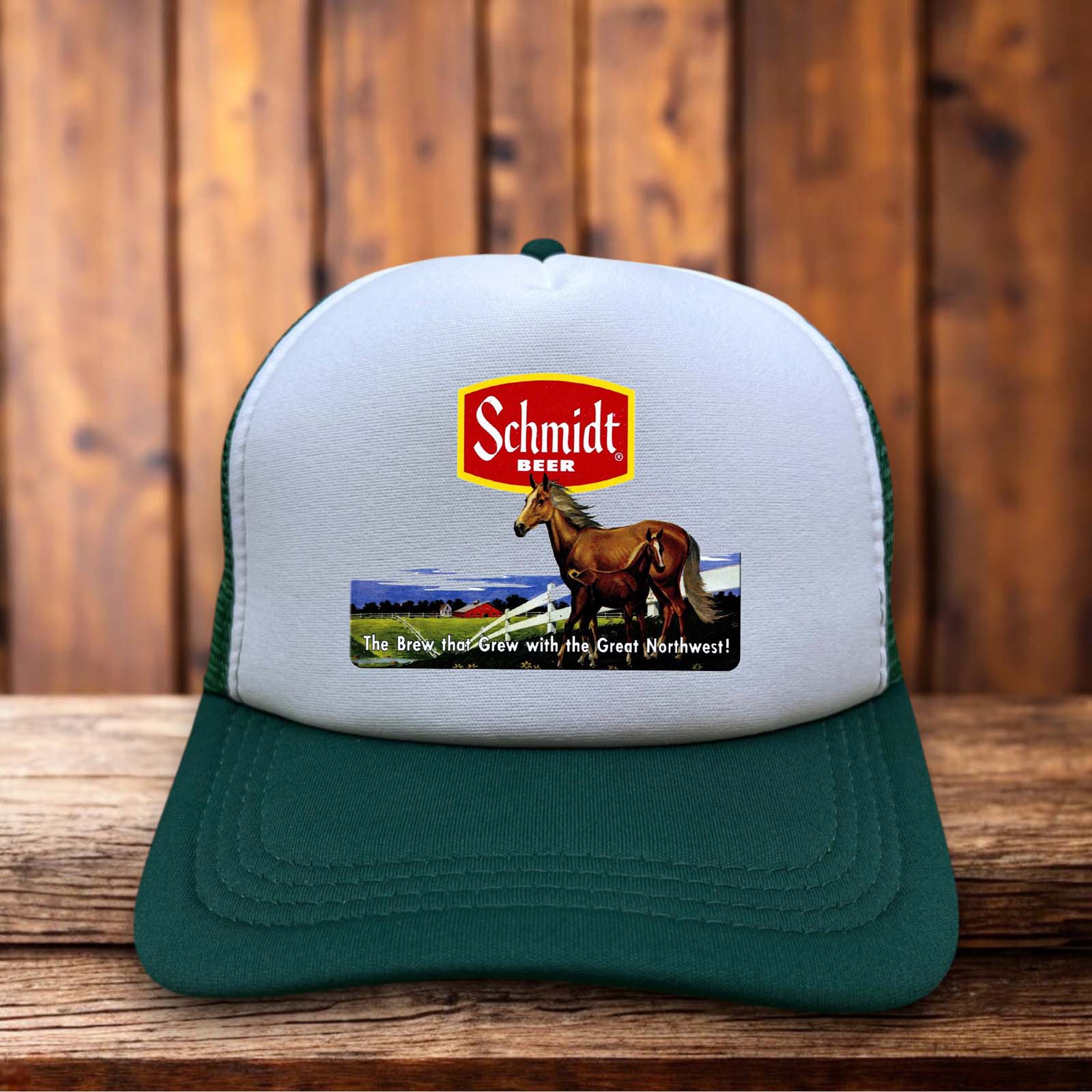 A green and white retro trucker hat featuring a white foam front with the 1970s Schmidt Beer galloping horse logo and green mesh back.