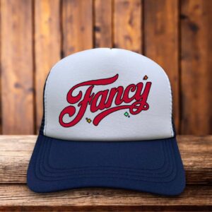 A retro trucker hat featuring a vintage-style graphic of Reba McEntire with bold "Fancy" typography on a structured foam front.