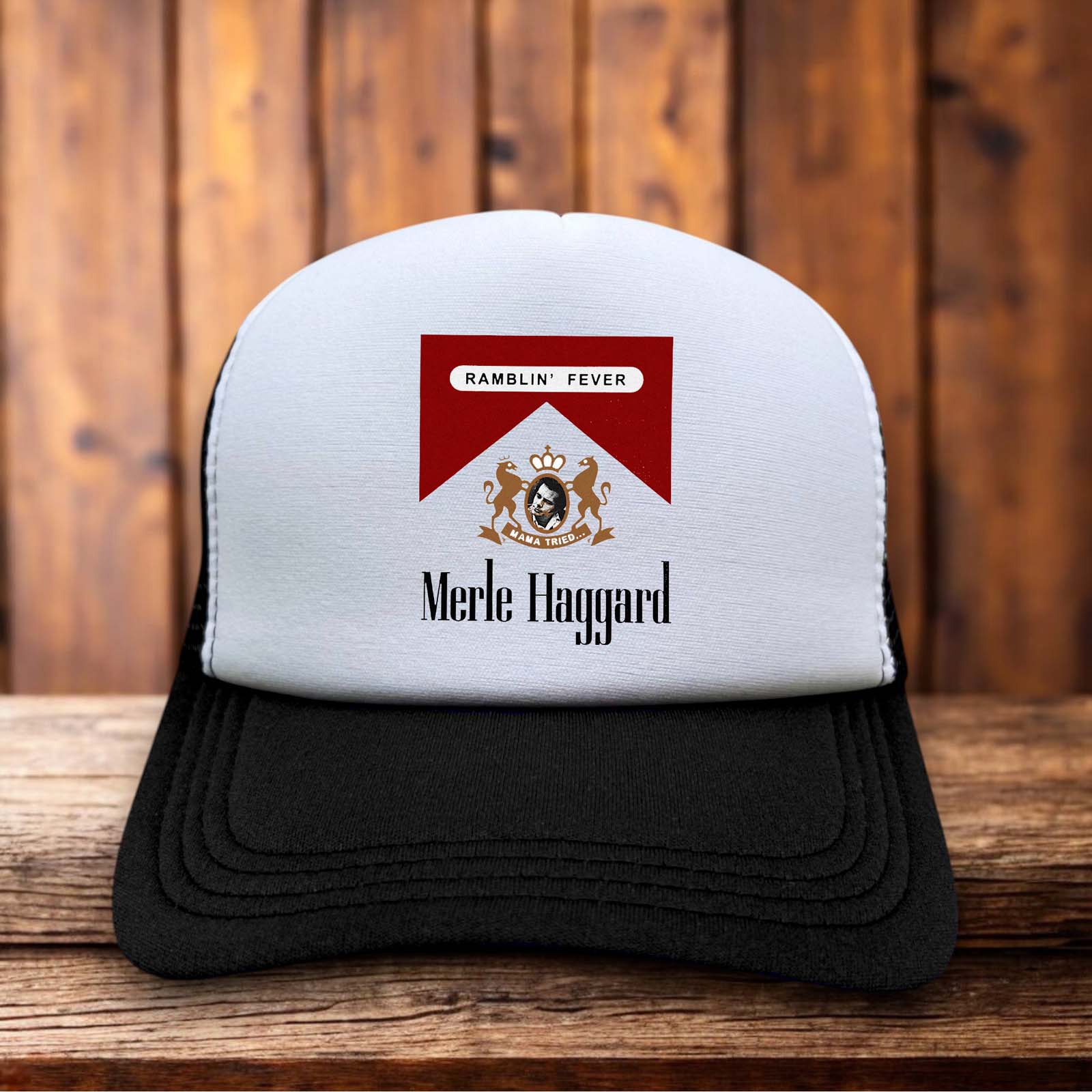 A retro trucker hat featuring bold "Ramblin' Fever" typography and a Merle Haggard graphic on a structured foam front.