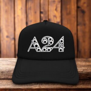 An all-black trucker hat with a structured foam front featuring a pair of googly eyes above the minimalist A24 logo.