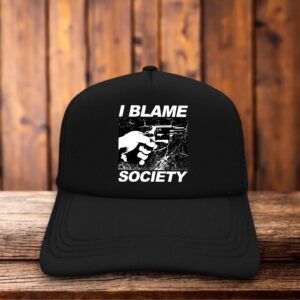 A vintage-style trucker hat with a black foam front featuring a white graphic of a handgun and the distressed text "I Blame Society" in a 90s-inspired, high-contrast punk font.