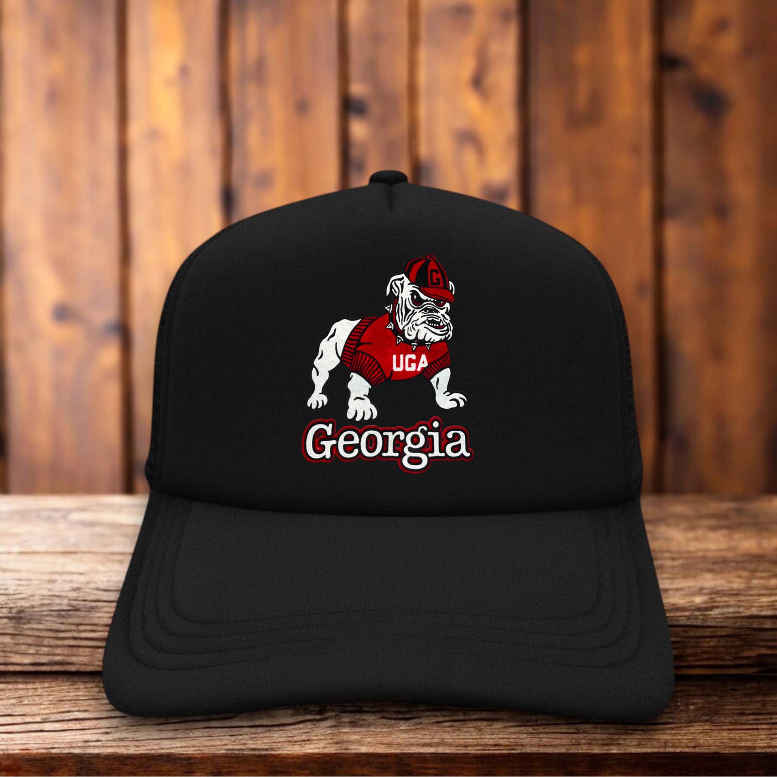 A red and black trucker hat featuring a vintage Georgia Bulldogs football logo.