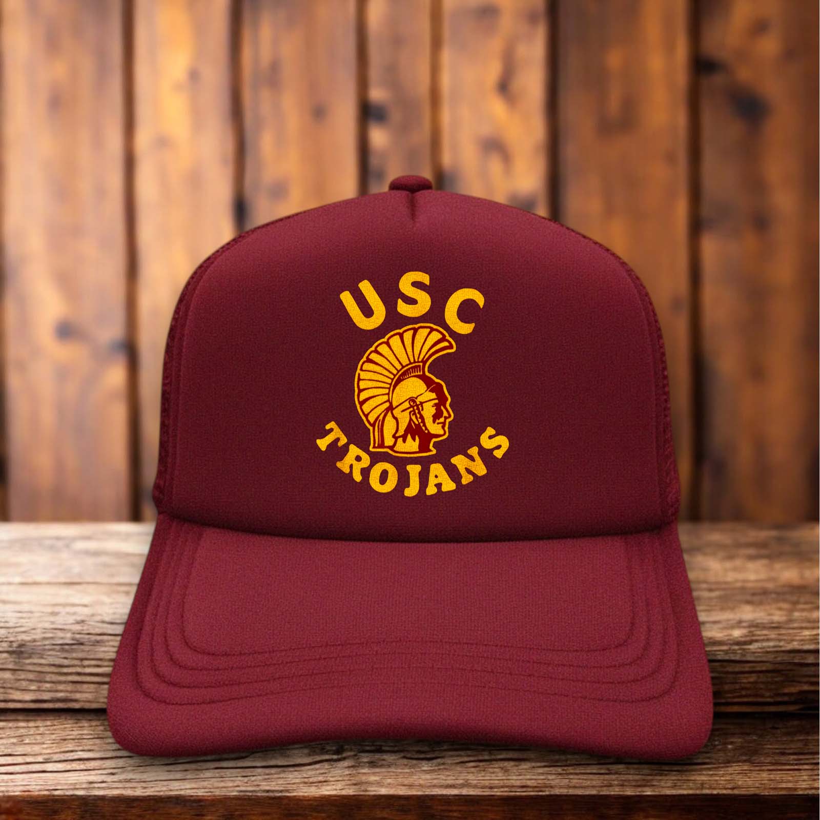 A two-toned polyester trucker hat featuring a vintage USC Trojans logo.