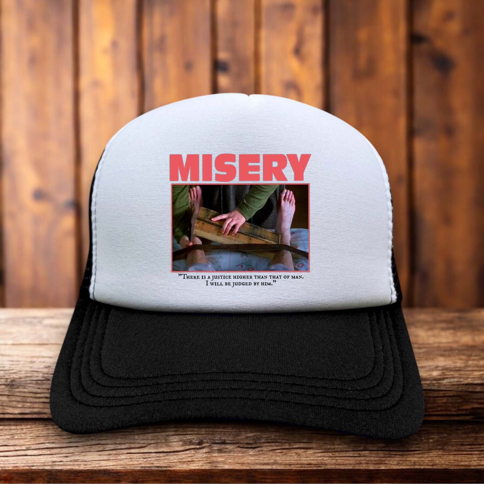 Retro trucker hat with a structured foam front featuring the Misery book-style logo and vintage typewriter-inspired typography.