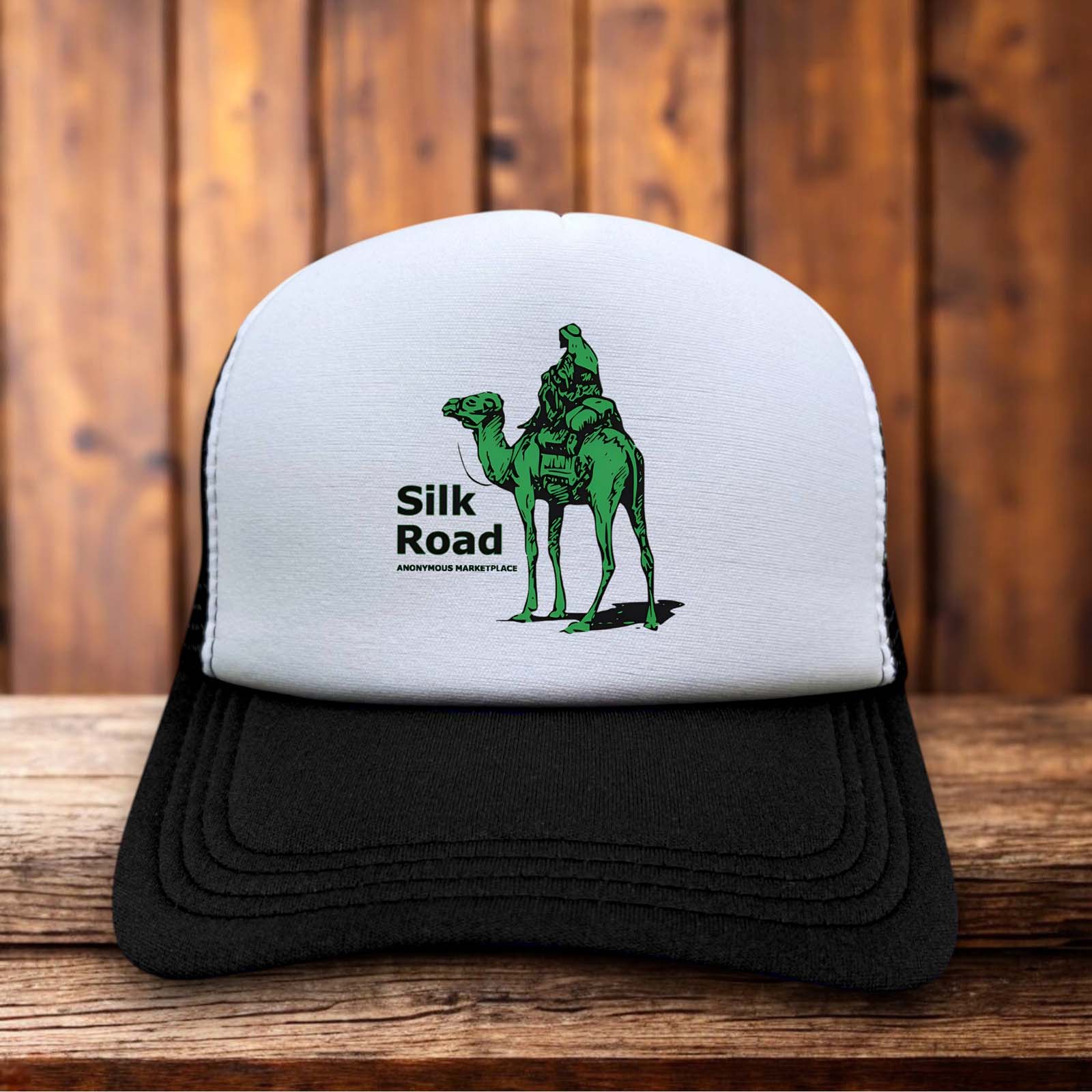 A retro trucker hat with a white foam front featuring the original green Silk Road camel logo and pixelated marketplace typography.