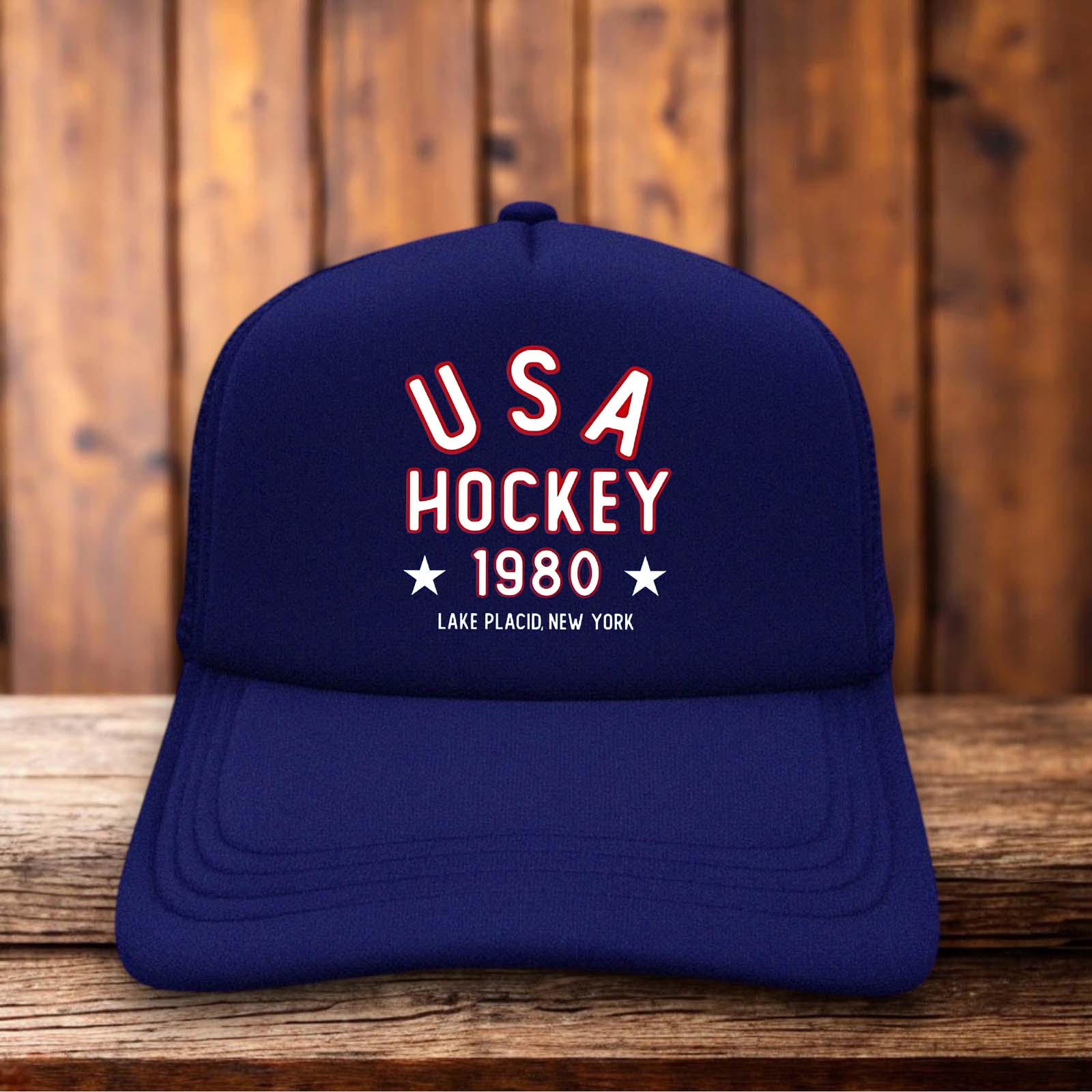 A retro trucker hat with a white foam front featuring the 1980 USA Hockey logo and "Miracle On Ice" text in red and blue vintage typography.