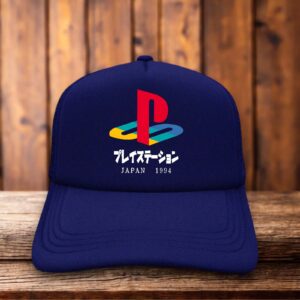 A retro trucker hat with a white foam front featuring the original four-color Playstation logo and 1994 Japanese launch text.