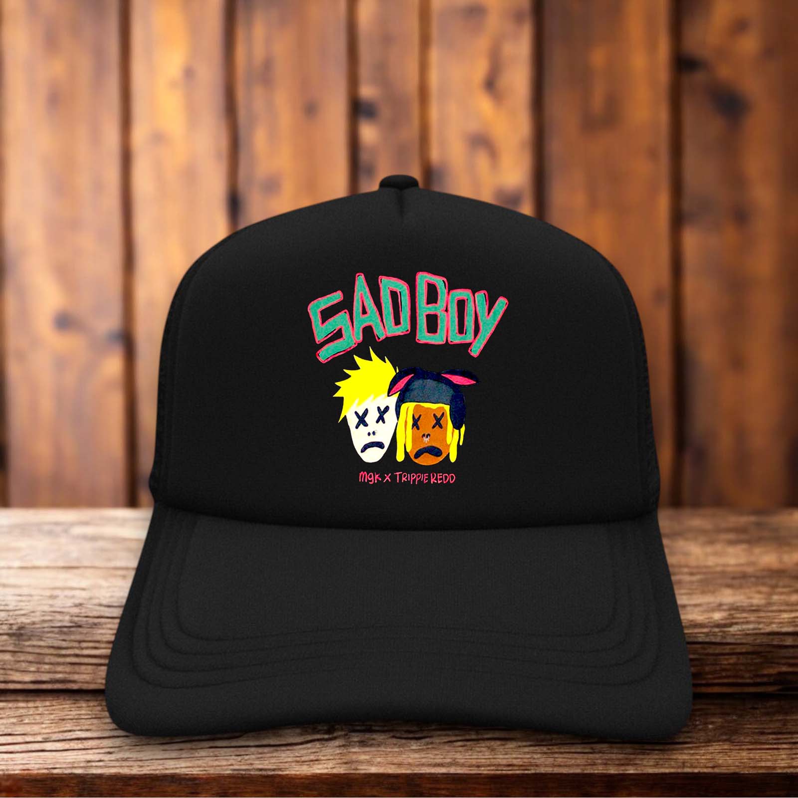 Black and pink trucker hat featuring the Machine Gun Kelly Sad Boy logo on a structured foam front.