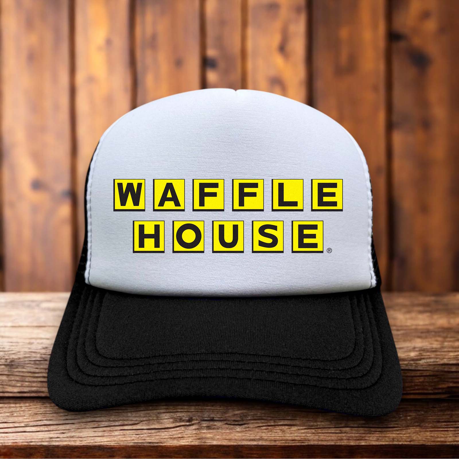Yellow and black retro trucker hat featuring the Waffle House block logo on a structured foam front.