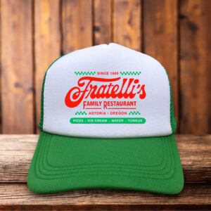 Green retro trucker hat featuring the Fratelli's logo from The Goonies in vintage-style typography on a structured foam front.