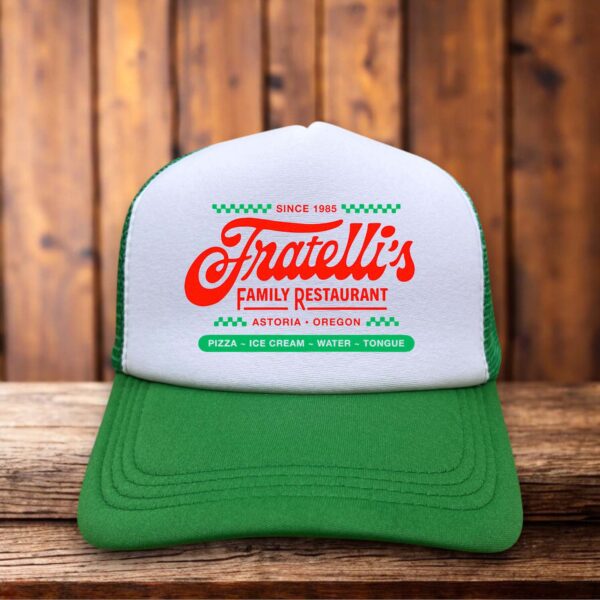 Green retro trucker hat featuring the Fratelli's logo from The Goonies in vintage-style typography on a structured foam front.