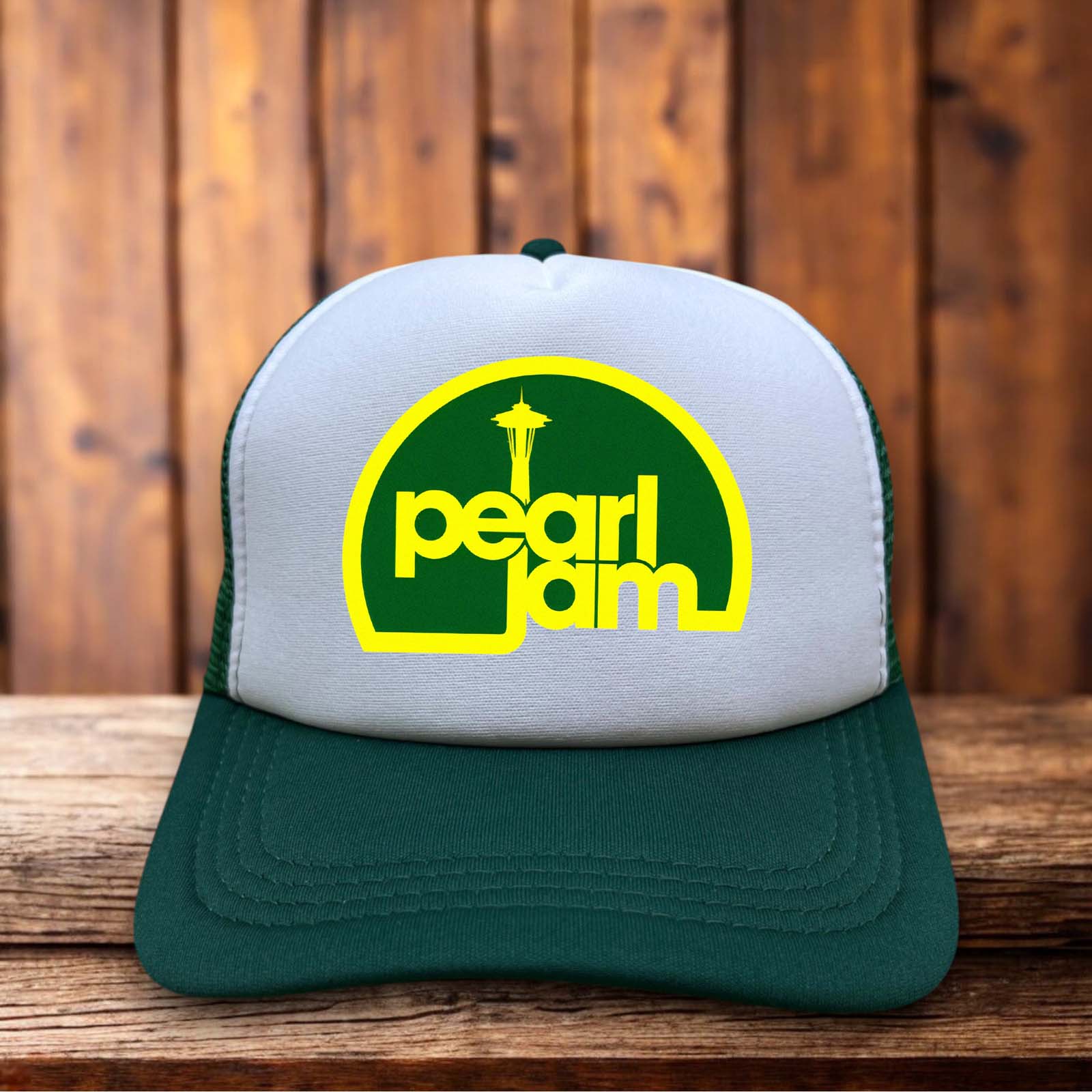 A classic trucker hat with a vintage-washed front panel featuring a distressed Pearl Jam logo and Eddie Vedder inspired typography in a 90s rock style.