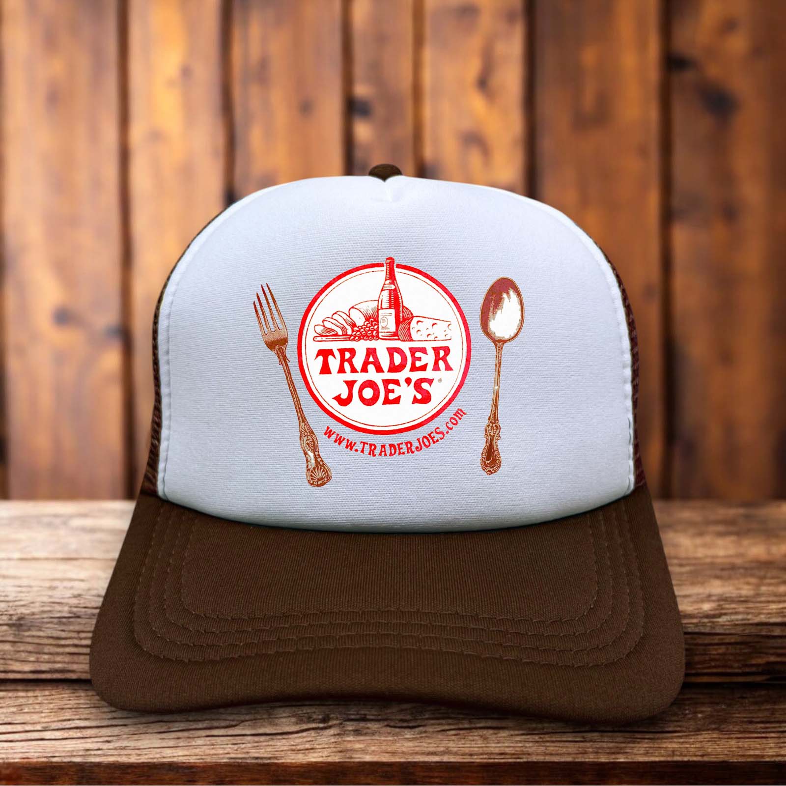 A classic trucker hat with a white foam front featuring a rare, vintage-style Trader Joe's logo in bold red and tropical-inspired typography.